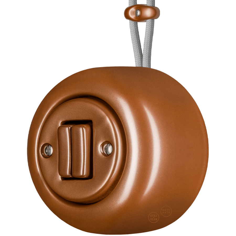 PORCELAIN KATY PATY COLONA ROUND SURFACE MOUNTED DOUBLE SLIM BUTTON SWITCH COPPER - DYKE & DEAN