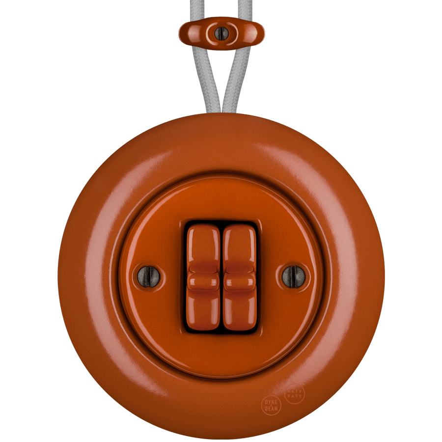 PORCELAIN KATY PATY COLONA ROUND SURFACE MOUNTED DOUBLE TOGGLE BUTTON SWITCH BRICK RED - DYKE & DEAN