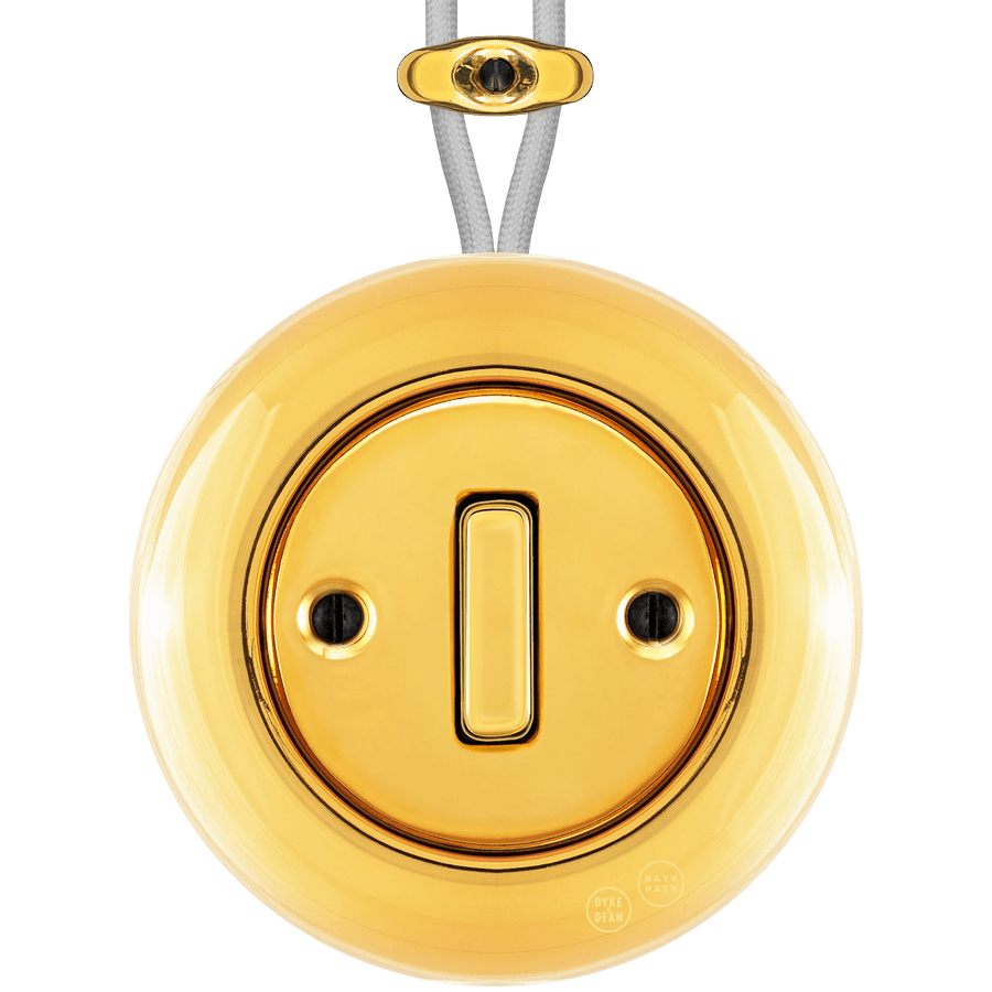 PORCELAIN KATY PATY COLONA ROUND SURFACE MOUNTED SLIM BUTTON SWITCH GOLD - DYKE & DEAN