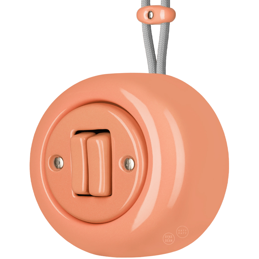 PORCELAIN ROUND SURFACE MOUNTED DOUBLE SLIM BUTTON SWITCH SALMON PINK - DYKE & DEAN
